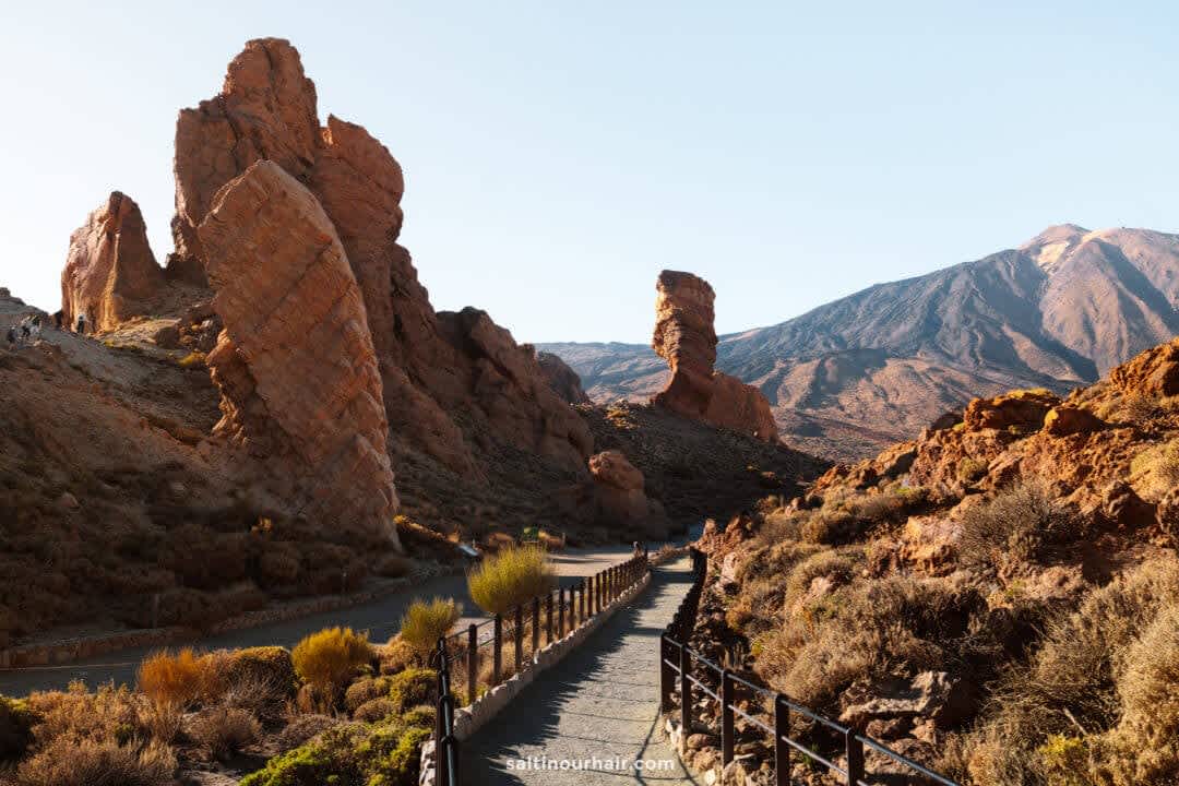 Hiking trail through red volcanic rock formations in Teide National Park, Tenerife.